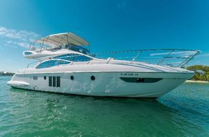 Azimut 48 Flybridge Azimut 48 Flybridge 2012 yacht on clear blue water under sunny sky.