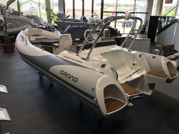 Grand G500HGLF Light Gray 2025 Grand G500HGLF Light Gray boat displayed indoors, showcasing sleek design and modern features.