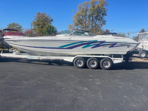 Formula 312 FASTech 1998 Formula 312FASTECH boat on trailer, parked outdoors, clear day.