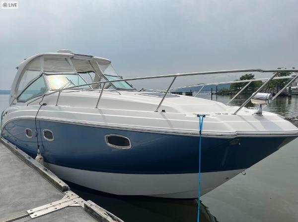 Chaparral 330 Signature 2014 Chaparral 330 Signature boat docked on calm water.