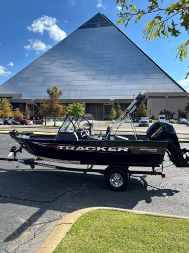 Tracker Pro Guide V-16 WT 2025 Tracker Pro Guide V-16 WT boat in front of a large pyramid building.