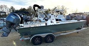 Avid Rogue 20 CC 2025 Avid Rogue 20 CC boat on trailer with Yamaha outboard motor.