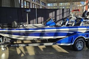 Ranger Z519R Cup-Equipped 2025 Ranger Z519R Cup-Equipped boat in showroom, blue and white design, on trailer.