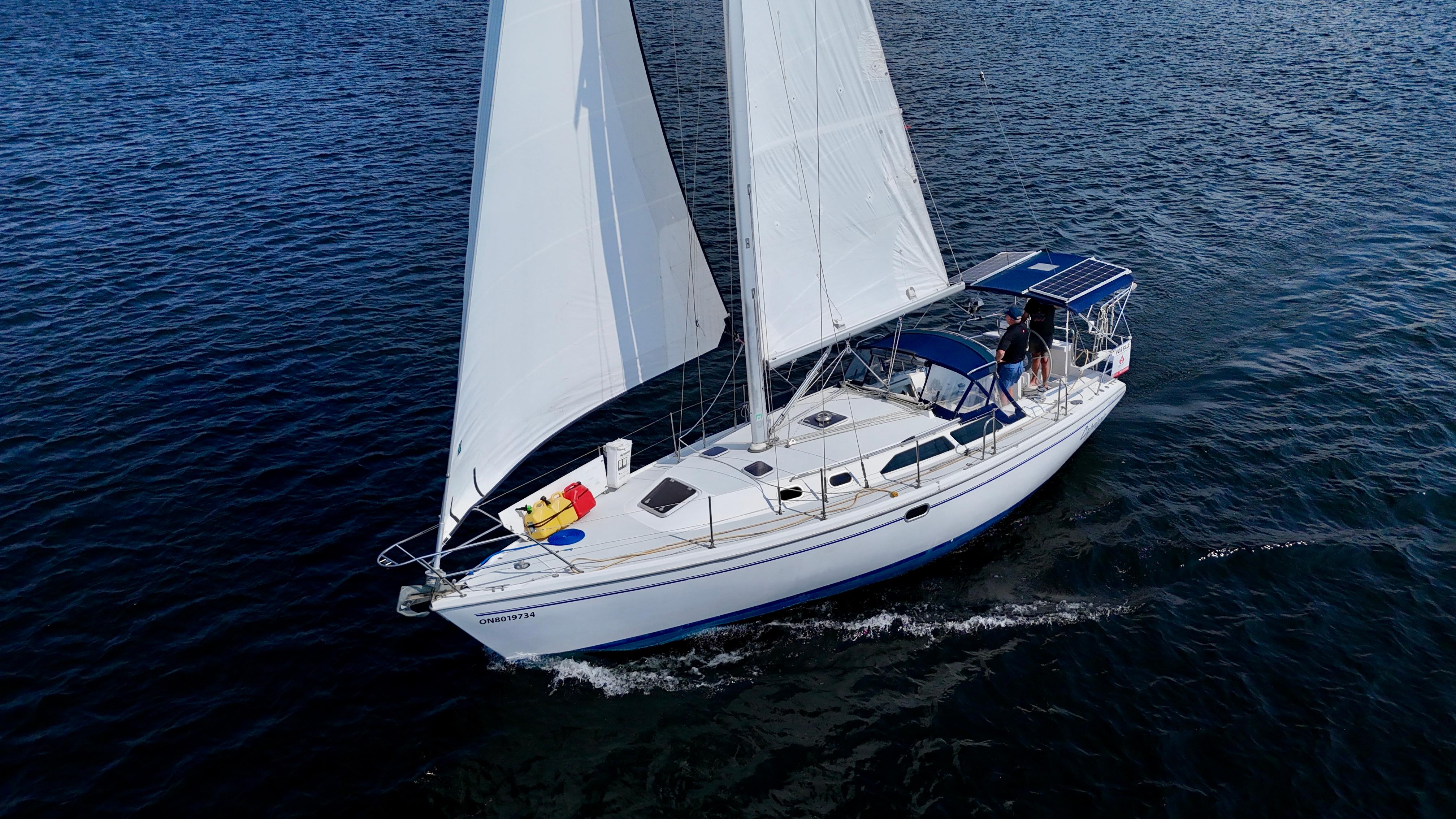 Catalina 36 MkII Catalina 36 MkII 2000 sailboat cruising on open water with full sails.