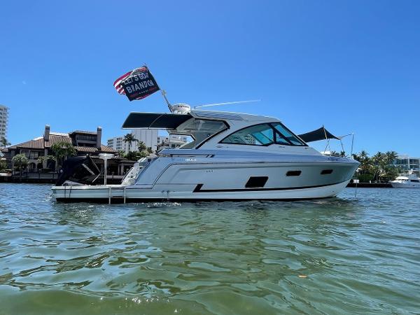 Formula 380 Super Sport Crossover OB 2021 Formula 380 Super Sport Crossover OB yacht on water, clear sky background.