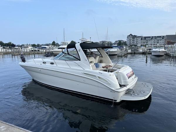 Sea Ray 380 Sundancer 1999 Sea Ray 380 Sundancer yacht docked in a marina, calm water, clear sky.