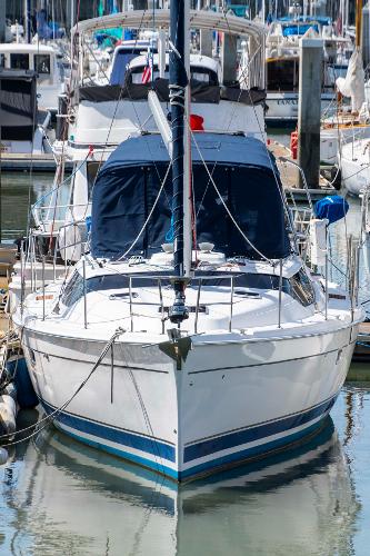 Hunter 45cc Hunter 45 CC sailboat from 2005 docked in a marina, surrounded by other boats.
