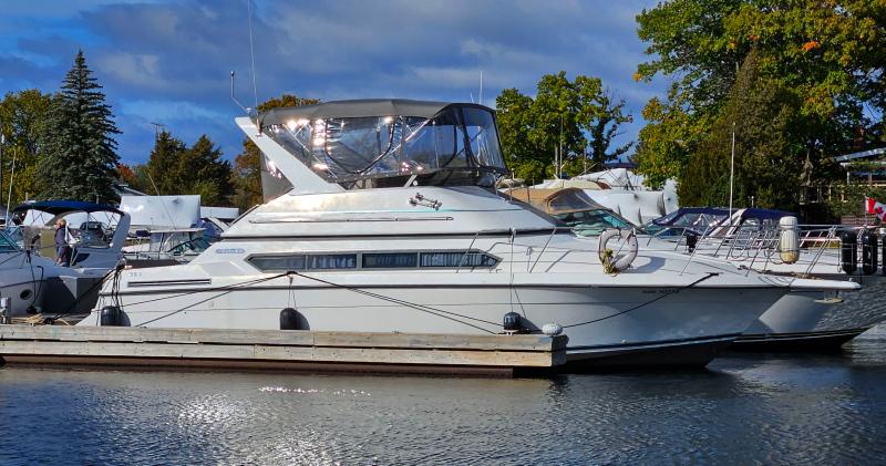 Carver 380 Santego 1994 Carver 380 Santego yacht docked at a marina, surrounded by trees and other boats.