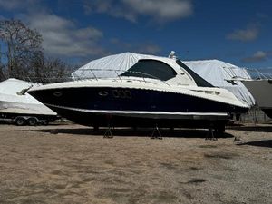 Sea Ray 380 Sundancer 2006 Sea Ray 380 Sundancer yacht on stands, outdoor storage, clear sky.