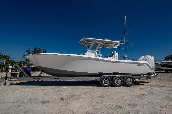 Invincible 33 Open Fisherman 2025 Invincible 33 Open Fisherman boat on a trailer, side view.