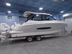 Regal 36 XO 2024 Regal 36XO boat on trailer in indoor storage facility.