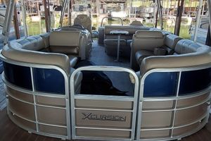 Xcursion 23RFC 2015 Xcursion 23RFC pontoon boat with spacious seating and modern design.