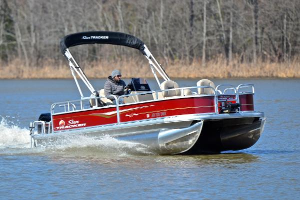 Sun Tracker BASS BUGGY 18 2022 Sun Tracker BASS BUGGY 18 pontoon boat cruising on a lake.