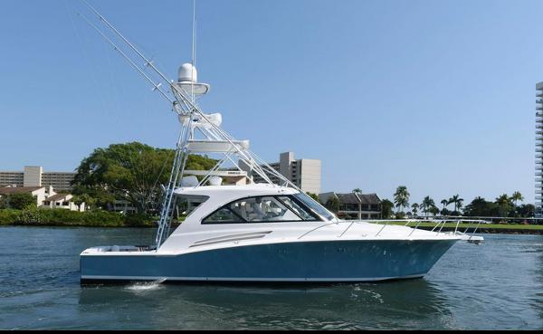 Hatteras 45 Express Sportfish 2015 Hatteras 45 Express Sportfish yacht on water, sleek design, blue hull, sunny day.