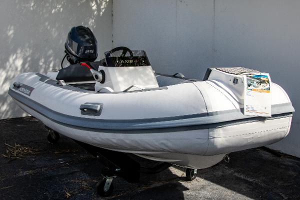 Northstar Axis 3.1 2021 Northstar Axis 3.1 inflatable boat with outboard motor, displayed outdoors.