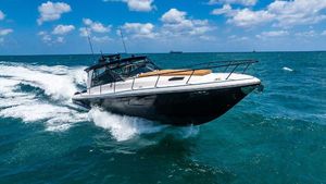 Intrepid 477 Evolution 2021 Intrepid 477 Evolution cruising on open ocean under blue sky.