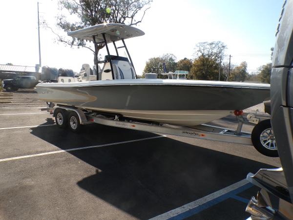 ShearWater 27 SS OPEN Carolina 2024 ShearWater 27 SS OPEN Carolina boat on trailer in parking lot.