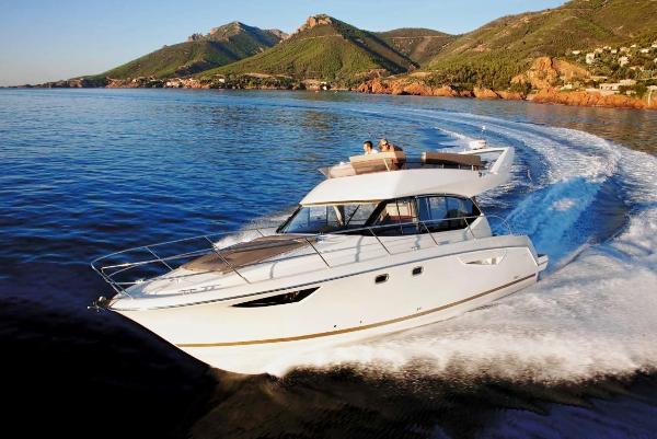 Prestige 400 2015 Prestige 400 yacht cruising on scenic coastal waters.