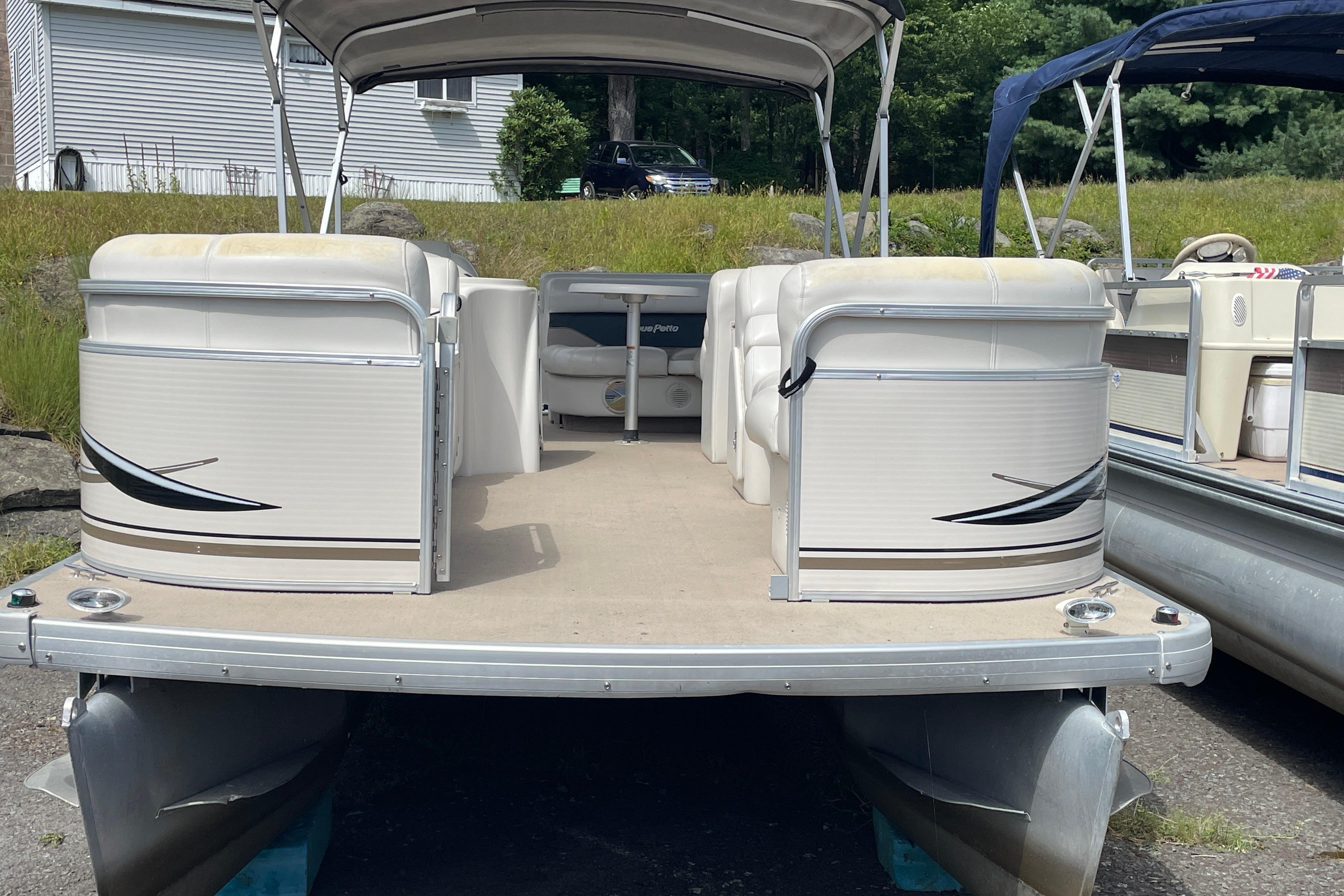 Godfrey Aqua Patio 2424DF 2002 Godfrey Aqua Patio 2424DF pontoon boat with spacious seating and canopy.
