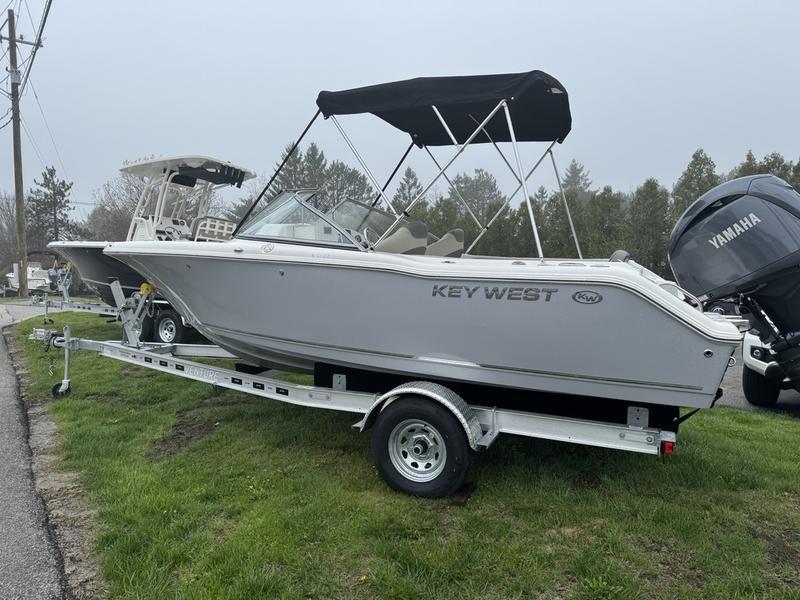 Key West 203 DFS 2025 Key West 203 DFS boat on trailer with Yamaha engine, parked on grass.