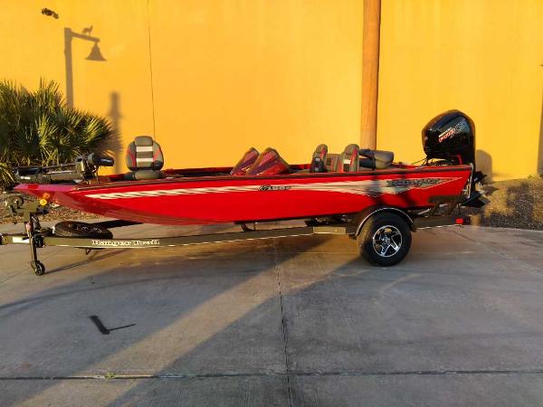 Ranger RT188P 2025 Ranger RT188P boat in vibrant red, parked outdoors on a trailer.