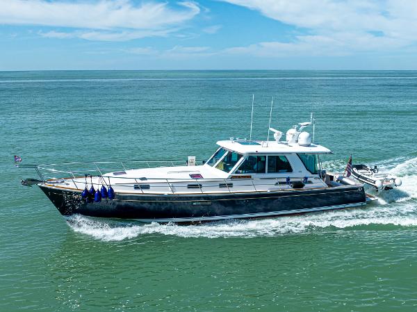 Sabre 52 Express 2009 Sabre 52 Express yacht cruising on open water under a clear blue sky.