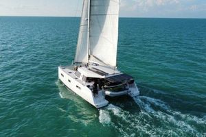 Nautitech 40 Open Sailing catamaran Nautitech 40 Open 2016 gliding on turquoise ocean waters.
