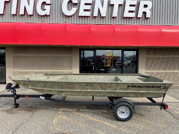 Tracker Grizzly 1648 Jon 2024 Tracker Grizzly 1648 Jon boat on trailer outside boating center.