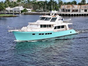 Marlow 66E Luxury Marlow 66E yacht cruising on a serene waterway, 2020 model.