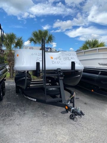Sun Tracker Bass Buggy® 16 XL Select 2026 Sun Tracker Bass Buggy® 16 XL Select pontoon boat on trailer, parked outdoors.