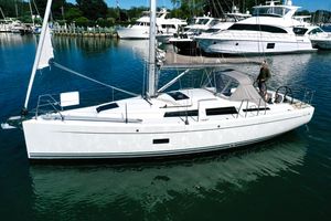 Hanse 348 2018 Hanse 348 sailboat docked in a marina, surrounded by other yachts.