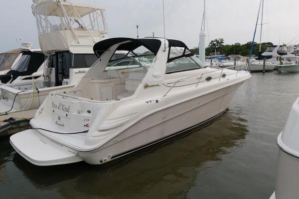 Sea Ray 330 Sundancer 1997 Sea Ray 330 Sundancer docked at a marina.