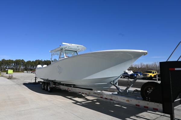 Onslow Bay 41 tournament edition 2021 Onslow Bay 41 Tournament Edition boat on trailer under clear blue sky.