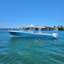 Everglades 355 Center Console 2018 Everglades 355 Center Console boat on clear blue water, sunny day.