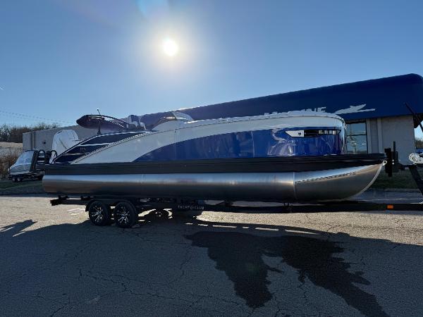 Bennington RX Sport Line 2024 Bennington RX Sport Line boat on trailer under bright sun.