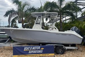 Key West 239 FS 2026 Key West 239 FS boat displayed at dealership with palm trees in background.