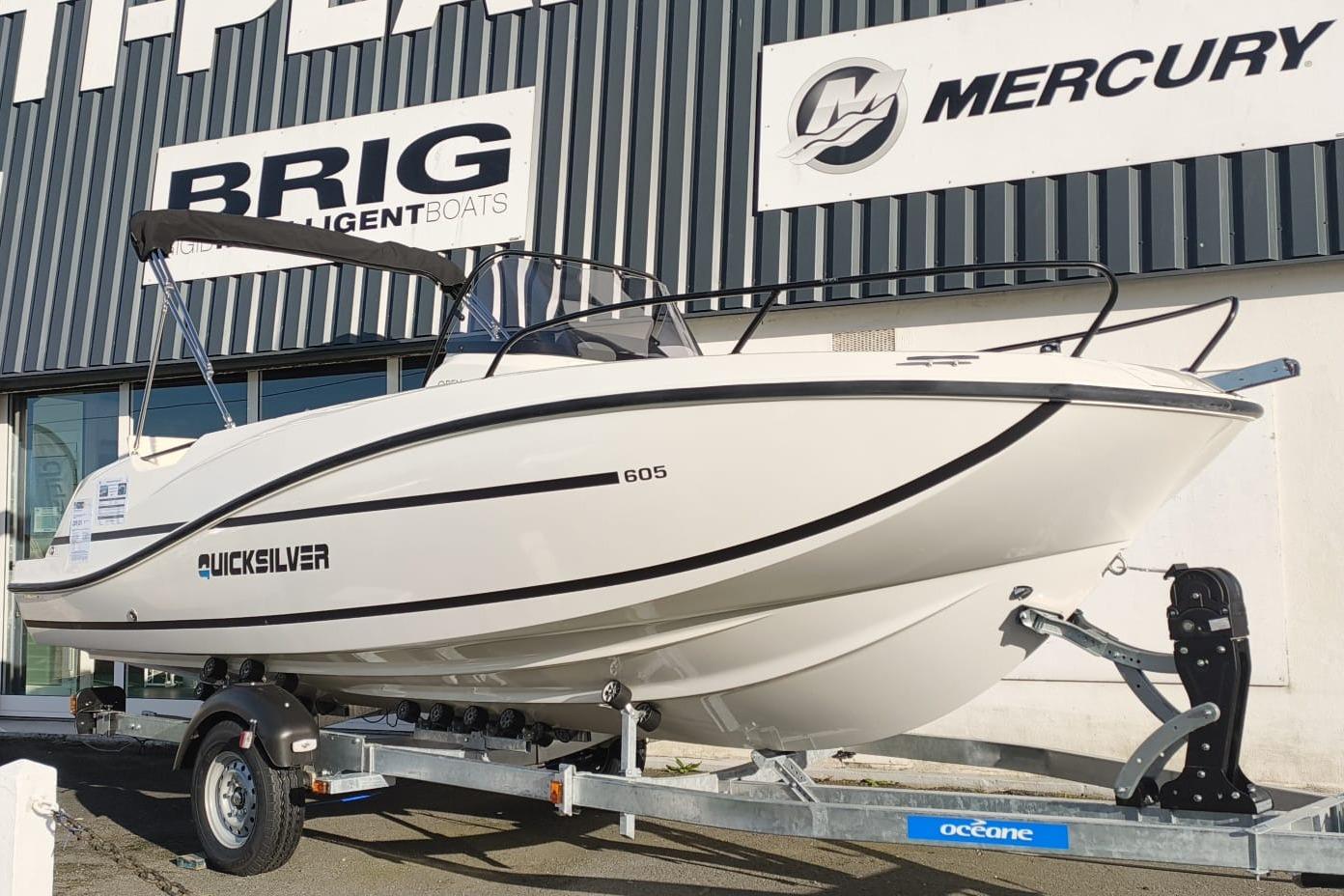 Quicksilver Activ 605 Open 2025 Quicksilver Activ 605 Open boat on trailer outside dealership.