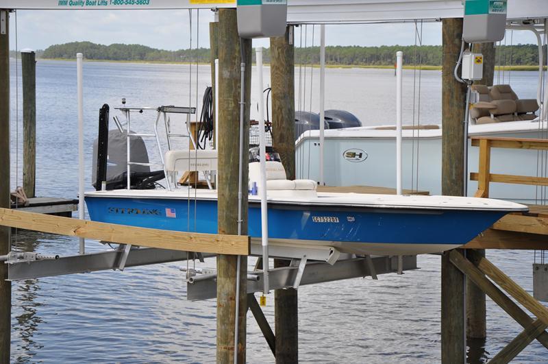 Sterling 180TS Blue 2008 Sterling 180TS boat on lift by the water.