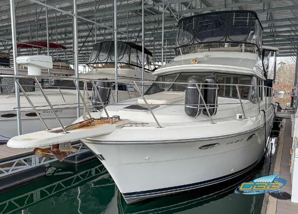 Carver 430 Cockpit Motor Yacht 1995 Carver 430 Cockpit Motor Yacht docked in a covered marina.