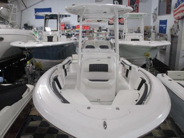 Tidewater 198 CC Adventure 2025 Tidewater 198 CC Adventure boat in showroom, featuring sleek white design and spacious seating.