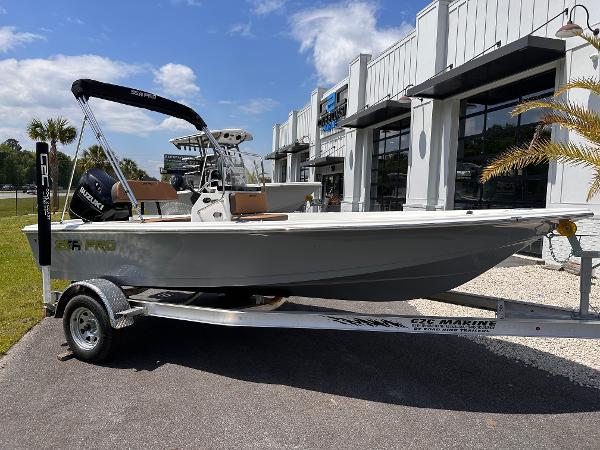 Sea Pro 172 2025 Sea Pro 172 boat on trailer, parked outside a dealership under a clear blue sky.