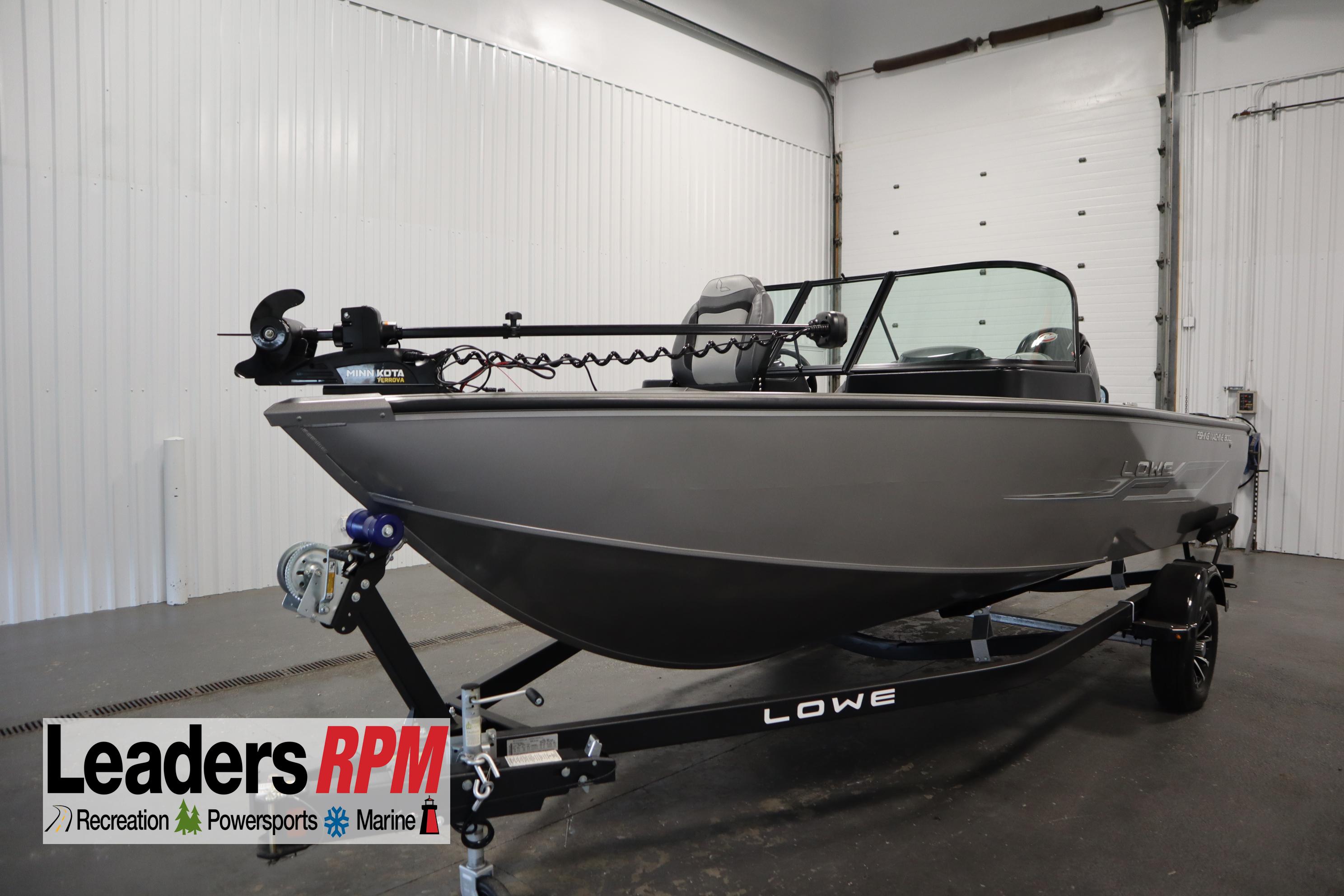 Lowe 1800 FM WT 2024 Lowe 1800 FM WT fishing boat on trailer in indoor showroom.