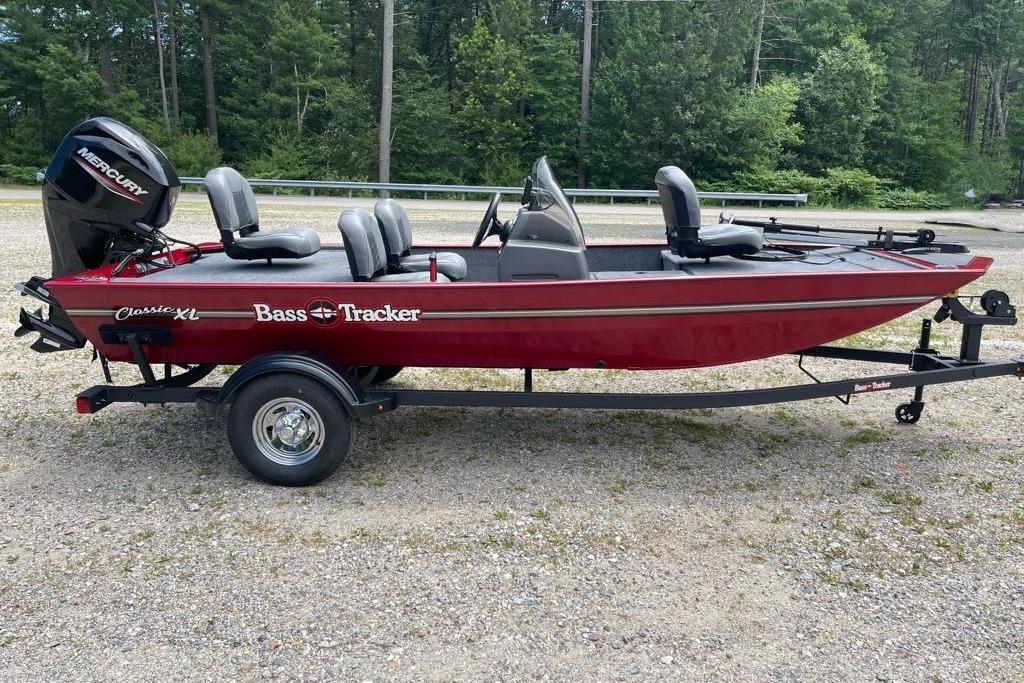 Tracker Bass Tracker Classic XL 2026 Tracker Bass Tracker Classic XL boat on trailer, red with Mercury outboard motor.