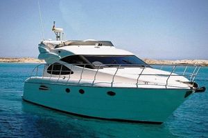 Astondoa 46 2002 Astondoa 46 yacht on clear blue water, sunny day.