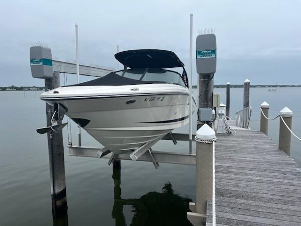 Sea Ray 270 SLX 2013 Sea Ray 270 SLX boat on lift at dock, covered and ready for use.