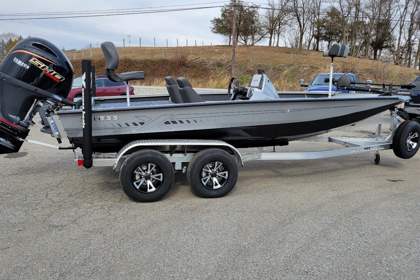 Xpress X19 Pro Bass w/ Yamaha Vmax 200 SHO (On order) ETA November 2026 Xpress X19 Pro Bass boat with Yamaha Vmax 200 SHO engine on trailer.