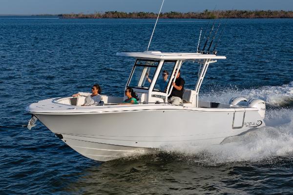Robalo R270 Center Console 2025 Robalo R270 Center Console boat cruising on open water with passengers.