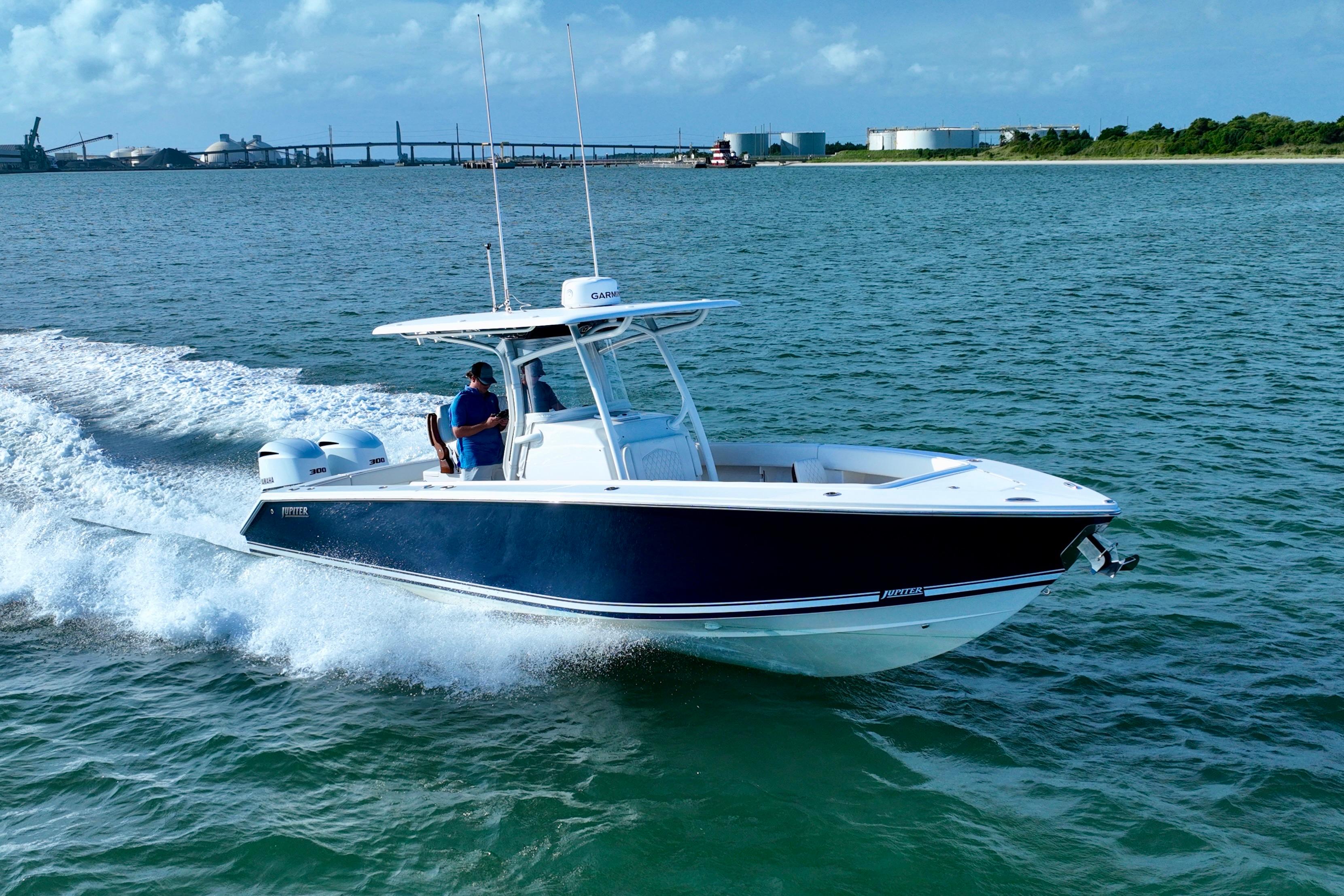 Jupiter 30 2021 Jupiter 30 boat cruising on open water, clear sky background.
