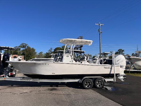 Tidewater 2500 Carolina Bay 2021 Tidewater 2500 Carolina Bay boat on trailer, parked outdoors under clear blue sky.