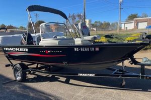 Tracker Pro Guide V-16 WT 2016 Tracker Pro Guide V-16 WT boat on trailer, black with red accents, parked outdoors.